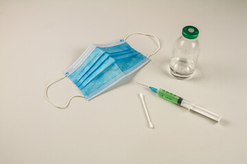 blue gloves medical swab for examination of covid 19 syringe and vaccine test