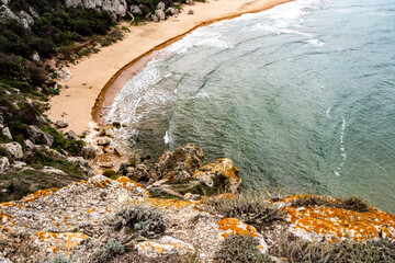 Mountains of steel and stones on the seashore. Wild beach. holidays, 