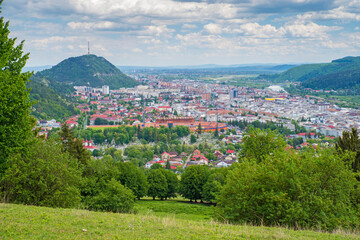 Summer city viewed from the green hill