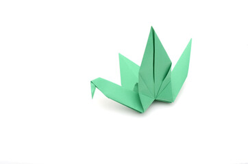 A green folding paper bird