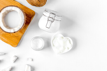 organic cosmetics with coconut on white background top view