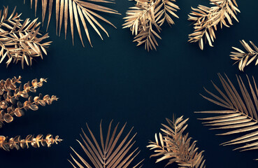 Collection of tropical leaves in gold color on black space background.Abstract leaf decoration design