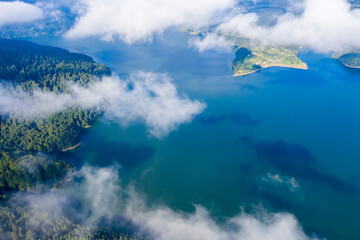 Fototapeta na wymiar Flying over summer mountain lake