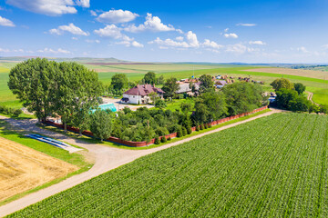 Fototapeta na wymiar Aerial view of farm buildings and fields