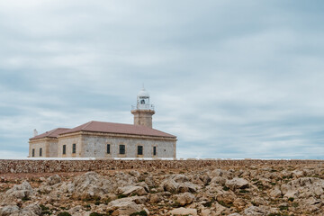 Fototapeta na wymiar Punta Nati Lighthouse, located in North West of Minorca, in Balearic Islands, Spain