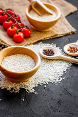ingredients for paella on dark background