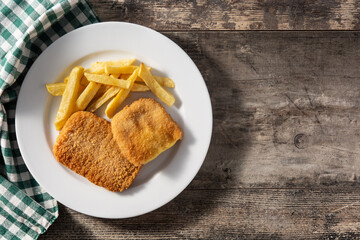 San Jacobo steak filled with cheese and ham on wooden table.Top view. Copy space