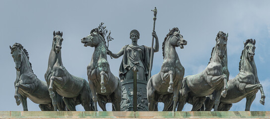 Statues of 6 horses and Goddess Victoria at the top of Triumphal Arch called Arch of Peace (Porta...