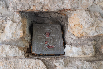 a plaque inserted into a wall