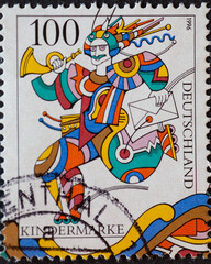 GERMANY - CIRCA 1996 : a postage stamp from Germany, showing a clown with a post horn and a letter.Text: children's stamp,