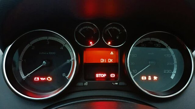 Handheld Shot Car Warning Light Symbols and Indicators on Car Dashboard 