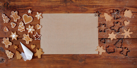 gingerbread in the different form on a brown wooden background. 2021 new year ginger cookies