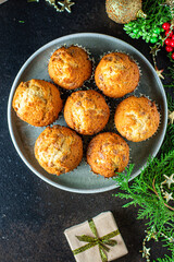 christmas sweet dessert muffins cupcakes and cup of tea party festive table setting holidays new year gift tasty top view copy space food background rustic