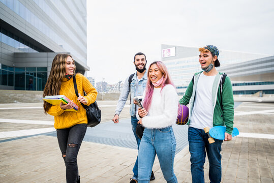 Multiracial Students Walking On City Street.- New Normal Lifestyle Concept With Friends Wearing Face Mask Going At School