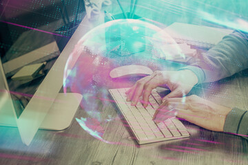 Technology theme hologram with man working on computer on background. High tech concept. Double...