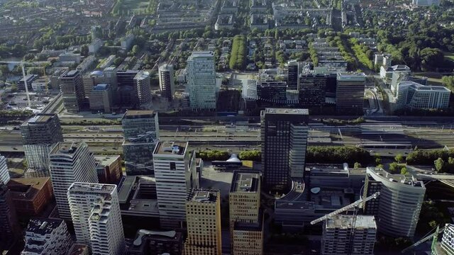 Aerial view of The Zuidas in Amsterdam on a sunny day. Financial Mile. Netherlands financial district with many buildings. It is located between the Amstel river and the A10 ringway.