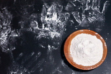 Handprints on a dark background. Cup with flour.