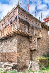 The view of traditional old small tibetan remote village and family house on Tibet