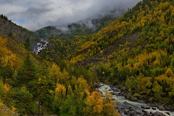 Fototapeta na wymiar Russia. Mountain Altai. Cascade waterfall 