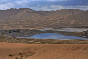 Yinderitu-Yindeertu Lake among dunes-mirroring dark water. Badain Jaran Desert-Inner Mongolia-China-1097