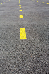 Roads separated by yellow lines, car parks separated by yellow lines