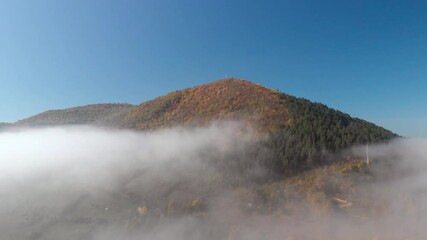 Epic aerial shot of the biggest pyramid on earth surrounded by morning fog - the Bosnian pyramid of sun. Tale of the pyramids discovered by Semir Osmanagic.