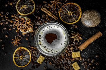 Festive Christmas coffee with sweets on a black background