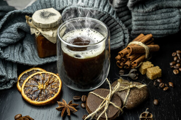 Winter warming coffee in a cozy atmosphere on a dark background