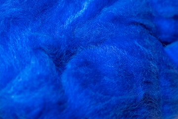Fototapeta premium Beautiful texture: colored natural wool for close-up felting. Materials for creativity and needlework.
