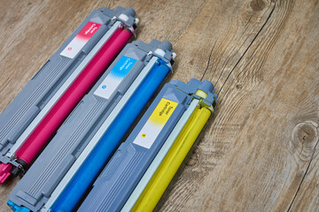 Color laser printer toner cartridges. Magenta, cyan, yellow.