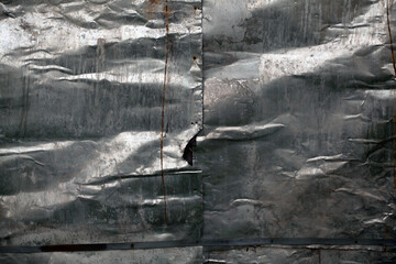 Metal tin surface. Steel rusty texture. The surface is deformed iron sheet. Background. Material...