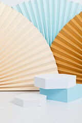 Podium, stand, platform for product presentation. Abstract background made of paper fans