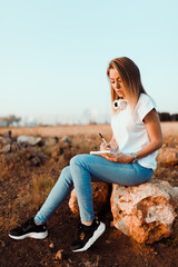 Young woman with her notebook annotated notes of communications