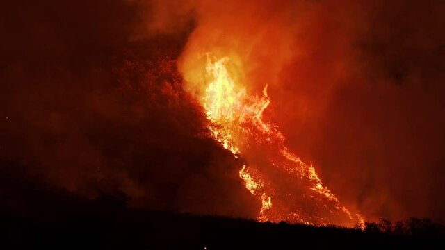 Flames from wildfire raging up mountainside in Utah as fire burns in Utah Valley in Springville.
