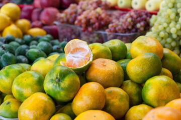 ripe tangerines lie on market counter ready for sale, healthy vitamin food concept