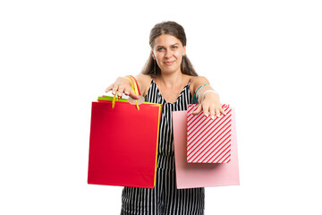 Adult woman presenting shopping bags as shopaholic lifestyle