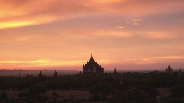 Romantic Sunset view of a temple in Bagan, Myanmar.
Wide Angle time-lapse shot at 4k resolution.No people.