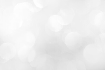 A brilliant blurry white background for a festive mood. Template for greeting card for entertainment.