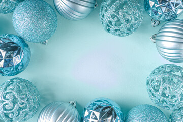 Christmas Festive Banner, Background. Monochrome Flat-lay with various blue Christmas Decoration Balls over light blue background, top view copy space, simple pattern