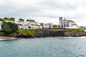 Portugal, Azores, Island of Sao Miguel. 
Beach Grande and the catholic church Sao Roque, 