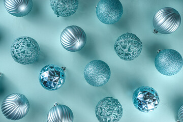 Christmas Festive Banner, Background. Monochrome Flat-lay with various blue Christmas Decoration Balls over light blue background, top view copy space, simple pattern