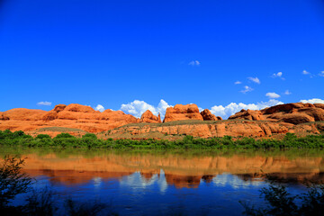 Fototapeta na wymiar Moab, Utah red rock along a river bank.