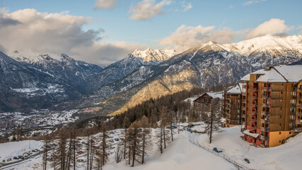 Risoul resort buildings, French alps in winter, snowy mountains in France