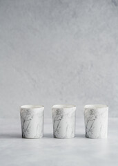 marble candles on grey background