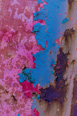 Abstract background of decaying old colorful painted wall