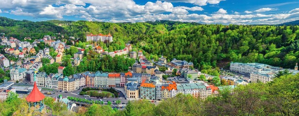 Karlovy Vary city aerial panoramic view with row of colorful multicolored buildings and spa hotels...