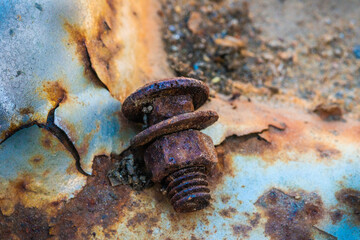 Colorful rusted metal screw bolt