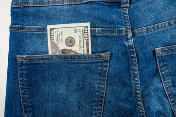 dollars in the pocket of blue jeans. Close-up.