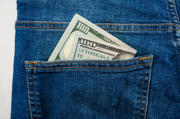 dollars in the pocket of blue jeans. Close-up.