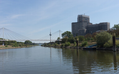 Mannheim / Germany – Sept. 13, 2020: cityscape with bridge at the „Rhine-Neckar harbor“, one...